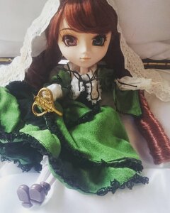 Rating: Safe Score: 0 Tags: 1girl bangs brown_hair doll dress frills green_dress jewelry lolita_fashion long_hair long_sleeves looking_at_viewer smile solo standing suiseiseki User: admin