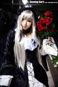 Rating: Safe Score: 0 Tags: 1girl black_dress dress flower frills gothic_lolita lips lolita_fashion long_hair red_eyes rose solo suigintou User: admin