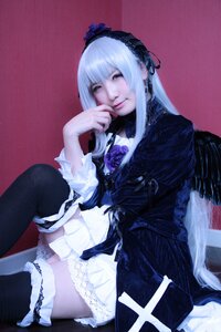 Rating: Safe Score: 0 Tags: 1girl black_legwear dress frills gothic_lolita hairband lolita_fashion long_hair long_sleeves sitting solo suigintou thighhighs User: admin