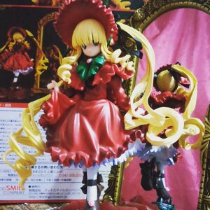 Rating: Safe Score: 0 Tags: 1girl blonde_hair blue_eyes bonnet bow doll dress frills full_body long_hair long_sleeves looking_at_viewer photo red_dress shinku sitting solo standing User: admin