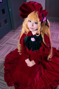 Rating: Safe Score: 0 Tags: 1girl blonde_hair blue_eyes bonnet bow dress flower lips long_hair long_sleeves looking_at_viewer red_dress rose shinku solo User: admin