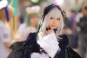 Rating: Safe Score: 0 Tags: 1girl bangs black_wings blurry blurry_background blurry_foreground closed_mouth depth_of_field dress feathered_wings feathers flower hairband lips long_hair looking_at_viewer red_eyes silver_hair solo suigintou wings User: admin