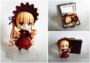 Rating: Safe Score: 0 Tags: 1girl blonde_hair blue_eyes bonnet bow chibi doll dress frills long_hair long_sleeves looking_at_viewer multiple_views shinku sitting solo twintails User: admin