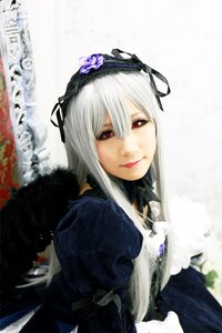 Rating: Safe Score: 0 Tags: 1girl blurry depth_of_field dress flower frills hairband lips long_hair long_sleeves looking_at_viewer red_eyes ribbon rose silver_hair solo suigintou User: admin