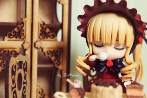 Rating: Safe Score: 0 Tags: 1girl blonde_hair blurry blurry_background blurry_foreground bonnet closed_eyes cup depth_of_field doll dress drill_hair flower long_hair photo red_rose rose shinku solo table teacup User: admin