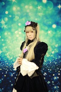 Rating: Safe Score: 0 Tags: 1girl bangs black_dress blonde_hair blurry dress flower hair_ornament long_hair long_sleeves looking_at_viewer pink_flower pink_rose rose solo sparkle standing suigintou User: admin