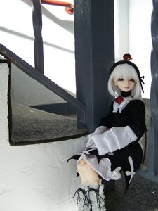 Rating: Safe Score: 0 Tags: 1girl doll dress flower hairband short_hair sitting solo suigintou white_hair User: admin