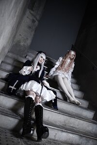 Rating: Safe Score: 0 Tags: 1girl black_footwear boots cross-laced_footwear dress frills gothic_lolita lace-up_boots long_hair multiple_cosplay sitting tagme weapon white_hair User: admin