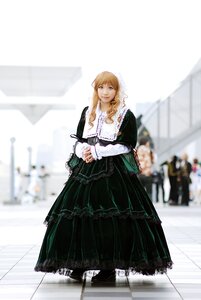 Rating: Safe Score: 0 Tags: 1girl blonde_hair blurry blurry_background blurry_foreground depth_of_field dress frills full_body long_hair long_sleeves looking_at_viewer solo standing suiseiseki User: admin