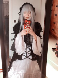 Rating: Safe Score: 0 Tags: 1girl bangs black_ribbon closed_eyes closed_mouth dress holding long_hair long_sleeves photo ribbon solo standing suigintou wide_sleeves User: admin