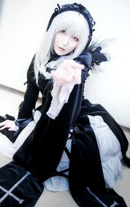 Rating: Safe Score: 0 Tags: 1girl 3d dress frills hairband long_hair long_sleeves looking_at_viewer outstretched_arm silver_hair solo suigintou User: admin