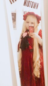 Rating: Safe Score: 0 Tags: 1girl blonde_hair cellphone coat dress hat holding holding_phone long_hair mirror phone red_dress reflection shinku smartphone solo User: admin