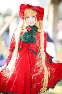 Rating: Safe Score: 0 Tags: 1girl blonde_hair blue_eyes blurry blurry_background blurry_foreground bonnet bow depth_of_field dress flower long_hair long_sleeves looking_at_viewer photo red_dress rose shinku sitting solo User: admin