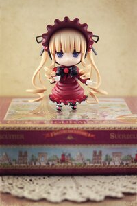 Rating: Safe Score: 0 Tags: 1girl blonde_hair blue_eyes bow chibi doll dress frills long_hair long_sleeves photo red_dress ribbon shinku solo User: admin