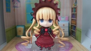 Rating: Safe Score: 0 Tags: 1girl blonde_hair blue_eyes bonnet book bookshelf bow bowtie chibi doll dress figure flower indoors long_hair long_sleeves looking_at_viewer photo red_dress room shinku shoes sitting solo standing User: admin