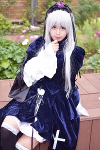 Rating: Safe Score: 0 Tags: 1girl black_legwear blurry depth_of_field hairband long_hair long_sleeves looking_at_viewer outdoors red_eyes sitting solo suigintou thighhighs white_hair User: admin