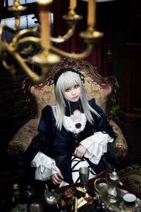 Rating: Safe Score: 0 Tags: 1girl black_dress blurry blurry_foreground chair closed_mouth depth_of_field dress flower frills hairband long_hair long_sleeves looking_at_viewer rose sitting solo suigintou User: admin