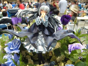 Rating: Safe Score: 0 Tags: black_dress blurry blurry_background blurry_foreground depth_of_field doll dress flower frills hairband long_hair long_sleeves multiple_girls red_eyes silver_hair solo standing suigintou white_hair wings User: admin