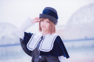 Rating: Safe Score: 0 Tags: 1girl bangs blonde_hair blue_headwear blurry blurry_background capelet closed_mouth depth_of_field dress hat lips long_sleeves looking_at_viewer photo short_hair solo souseiseki striped upper_body User: admin