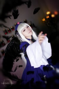 Rating: Safe Score: 0 Tags: 1girl bangs black_feathers black_wings blurry blurry_background blurry_foreground closed_mouth depth_of_field feathered_wings feathers flower hairband holding lips long_hair long_sleeves looking_at_viewer red_eyes ribbon solo suigintou wings User: admin