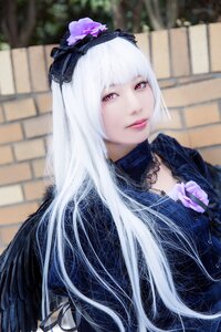 Rating: Safe Score: 0 Tags: 1girl bangs blurry blurry_background blurry_foreground closed_mouth depth_of_field flower gothic_lolita hairband lips lolita_fashion long_hair looking_at_viewer outdoors photo solo suigintou upper_body white_hair User: admin