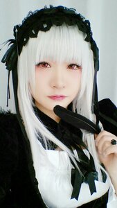 Rating: Safe Score: 0 Tags: 1girl bangs black_ribbon closed_mouth hairband lips long_hair looking_at_viewer nail_polish red_eyes ribbon simple_background solo suigintou User: admin