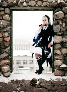 Rating: Safe Score: 0 Tags: 1girl black_footwear boots cross-laced_footwear dress high_heels holding long_sleeves solo standing suigintou User: admin