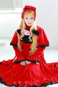 Rating: Safe Score: 0 Tags: 1girl blonde_hair blue_eyes bonnet capelet dress flower long_hair long_sleeves looking_at_viewer red_capelet red_dress rose shinku sitting solo User: admin