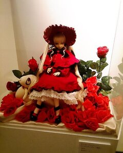 Rating: Safe Score: 0 Tags: 1girl blonde_hair doll dress flower hat long_hair red_dress red_flower red_rose rose shinku sitting solo stuffed_animal User: admin