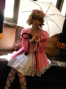 Rating: Safe Score: 0 Tags: 1girl blonde_hair blue_eyes dress hinaichigo holding_umbrella lips parasol pink_dress rain ribbon shared_umbrella solo umbrella User: admin