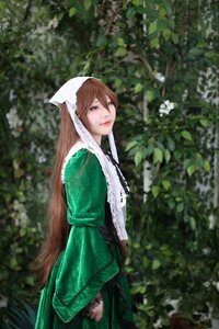 Rating: Safe Score: 0 Tags: 1girl blurry brown_hair closed_mouth depth_of_field dress green_dress head_scarf lips long_hair long_sleeves looking_at_viewer outdoors plant smile solo suiseiseki User: admin