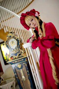 Rating: Safe Score: 0 Tags: 1girl auto_tagged blonde_hair blue_eyes blurry blurry_background bonnet bow depth_of_field dress flower indoors long_sleeves looking_at_viewer photo red_dress shinku solo User: admin