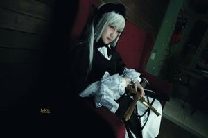 Rating: Safe Score: 0 Tags: 1girl bangs blunt_bangs dark dress frills hat indoors long_hair long_sleeves sitting solo suigintou User: admin