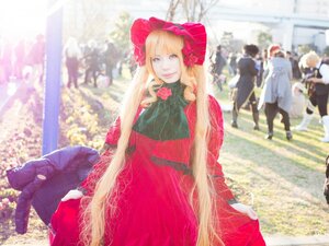 Rating: Safe Score: 0 Tags: 1girl blonde_hair blue_eyes blurry bonnet building city depth_of_field dress flower long_hair long_sleeves looking_at_viewer outdoors red_dress shinku solo standing User: admin