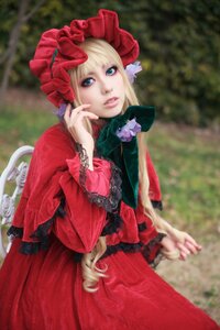 Rating: Safe Score: 0 Tags: 1girl blonde_hair blue_eyes blurry blurry_background bonnet depth_of_field dress flower frills lace lips long_sleeves looking_at_viewer outdoors photo realistic red_dress shinku solo User: admin