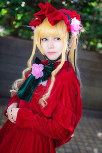 Rating: Safe Score: 0 Tags: 1girl bangs blonde_hair blue_eyes blurry blurry_background bonnet depth_of_field flower hat lips long_hair long_sleeves looking_at_viewer red_dress shinku solo upper_body User: admin