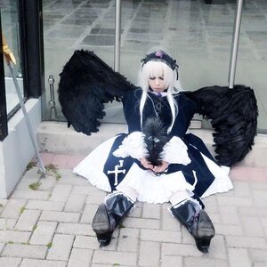 Rating: Safe Score: 0 Tags: 1girl black_wings boots dress feathers frills long_hair long_sleeves silver_hair sitting solo suigintou wings User: admin