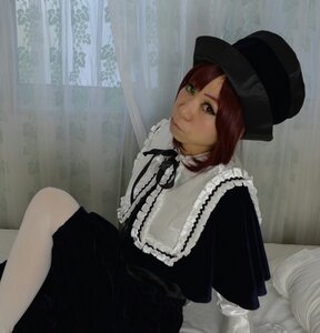 Rating: Safe Score: 0 Tags: 1girl brown_hair capelet closed_mouth dress frills hat heterochromia lolita_fashion long_sleeves looking_at_viewer red_eyes short_hair sitting solo souseiseki User: admin