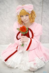 Rating: Safe Score: 0 Tags: 1girl blonde_hair blue_eyes dress flower frills hinaichigo pink_bow pink_dress red_flower red_rose ribbon rose sitting smile solo User: admin