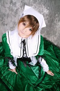 Rating: Safe Score: 0 Tags: 1girl bangs brown_eyes brown_hair dress frills green_dress heterochromia long_sleeves looking_at_viewer sitting smile solo suiseiseki User: admin