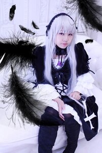 Rating: Safe Score: 0 Tags: 1girl bird black_wings dress feathers frills hairband long_hair long_sleeves red_eyes ribbon silver_hair sitting solo suigintou wings User: admin