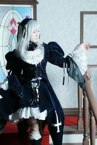 Rating: Safe Score: 0 Tags: 1girl black_dress boots closed_eyes dress flower frills gothic_lolita hair_ornament hairband indoors lolita_fashion long_hair long_sleeves silver_hair solo standing suigintou User: admin