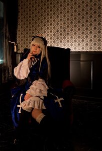 Rating: Safe Score: 0 Tags: 1girl bangs black_ribbon blonde_hair blue_dress dress gothic_lolita hair_ribbon indoors lolita_fashion long_hair long_sleeves looking_at_viewer ribbon sitting solo suigintou User: admin