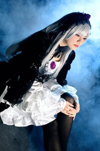 Rating: Safe Score: 0 Tags: 1girl black_legwear closed_mouth dress frills lips long_hair long_sleeves red_eyes sitting solo suigintou User: admin