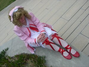 Rating: Safe Score: 0 Tags: 1girl blonde_hair dress hat hinaichigo long_hair long_sleeves own_hands_together red_footwear ribbon shoes sitting solo white_dress User: admin