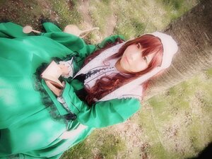 Rating: Safe Score: 0 Tags: 1girl brown_hair dress green_dress head_scarf holding long_hair long_sleeves looking_at_viewer outdoors red_eyes solo suiseiseki User: admin