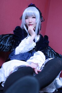 Rating: Safe Score: 0 Tags: 1girl black_legwear blurry dress frills gothic_lolita hairband long_sleeves realistic silver_hair sitting solo suigintou wings User: admin