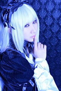 Rating: Safe Score: 0 Tags: 1girl bangs blue_background blue_theme blunt_bangs closed_mouth eyelashes finger_to_mouth flower hair_ornament lips long_hair long_sleeves looking_at_viewer pale_skin purple_eyes solo suigintou upper_body white_hair User: admin