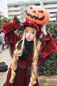 Rating: Safe Score: 0 Tags: 1girl arms_up bangs blonde_hair brick_wall building chain-link_fence city day dress drill_hair fence hat jack-o'-lantern lips long_hair long_sleeves looking_at_viewer outdoors pumpkin red_dress shinku solo street very_long_hair User: admin