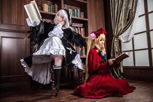 Rating: Safe Score: 0 Tags: 2girls angel angel_wings black_wings blonde_hair dress feathered_wings flower frills gothic_lolita indoors long_hair multiple_cosplay multiple_girls sitting suigintou tagme thighhighs window wings User: admin